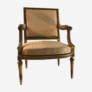 Louis XVI armchair in gilded wood carved and molded