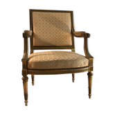 Fauteuil Louis XVI en bois doré sculpté et mouluré