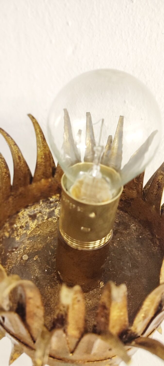 Wrought iron and gold leaf wall light. Spain, 1950s.