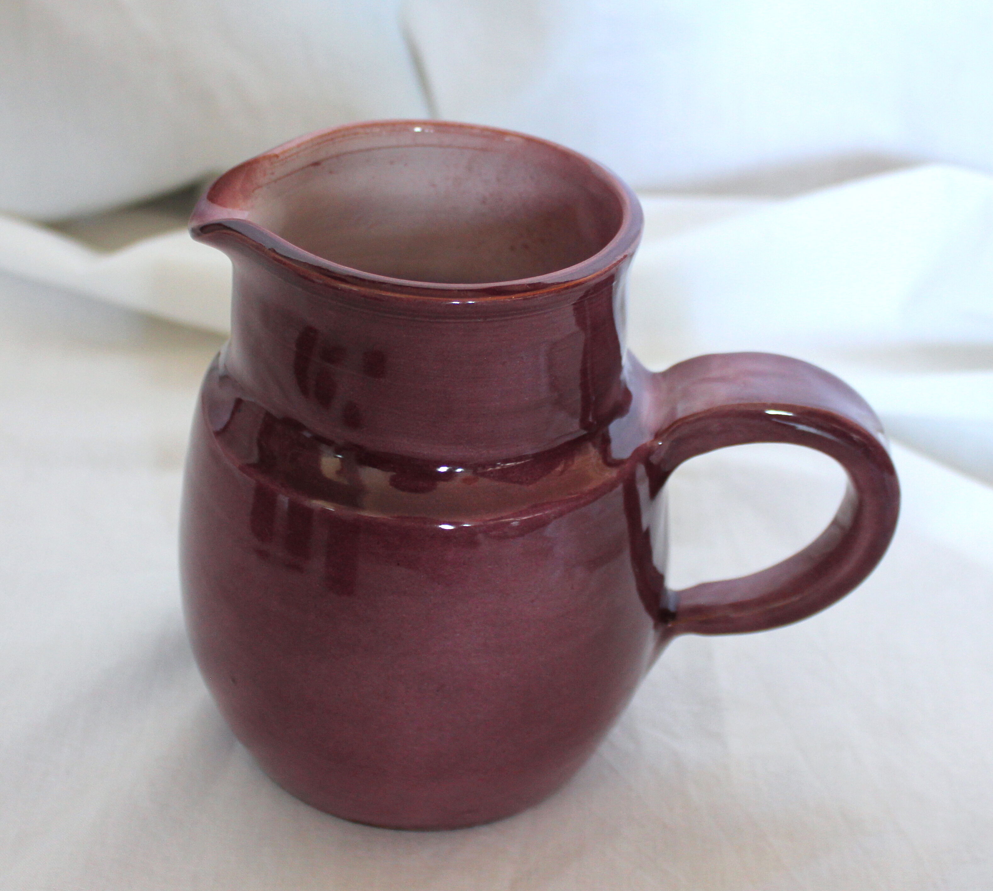 Purple ceramic pitcher and glasses set