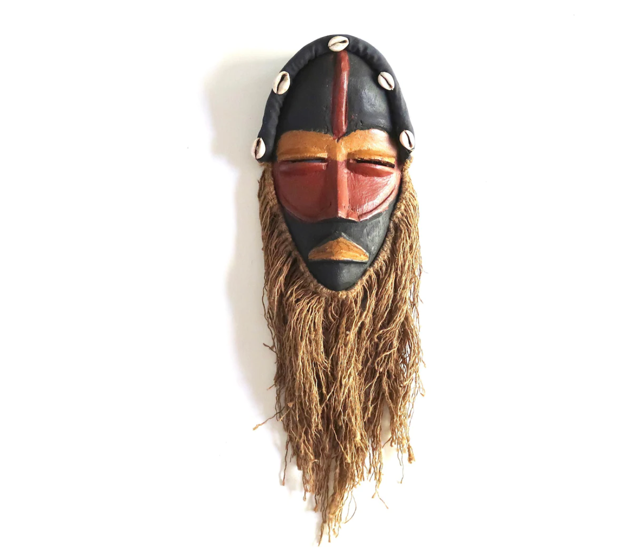 African wooden mask with shells and rope