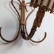 Rattan wall lights by Louis Sognot