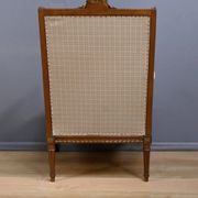 Wingback armchair in walnut, Louis XVI style – late 19th century