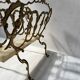 20th century openwork bronze and brass magazine rack