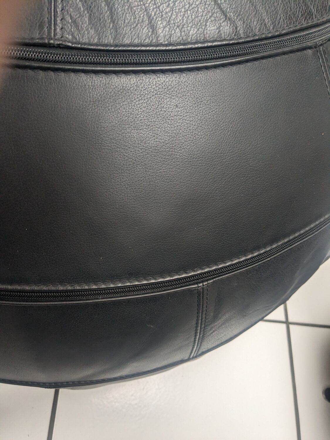 Black leather ottoman by Edwin and Niekel Taco for Leolux 90