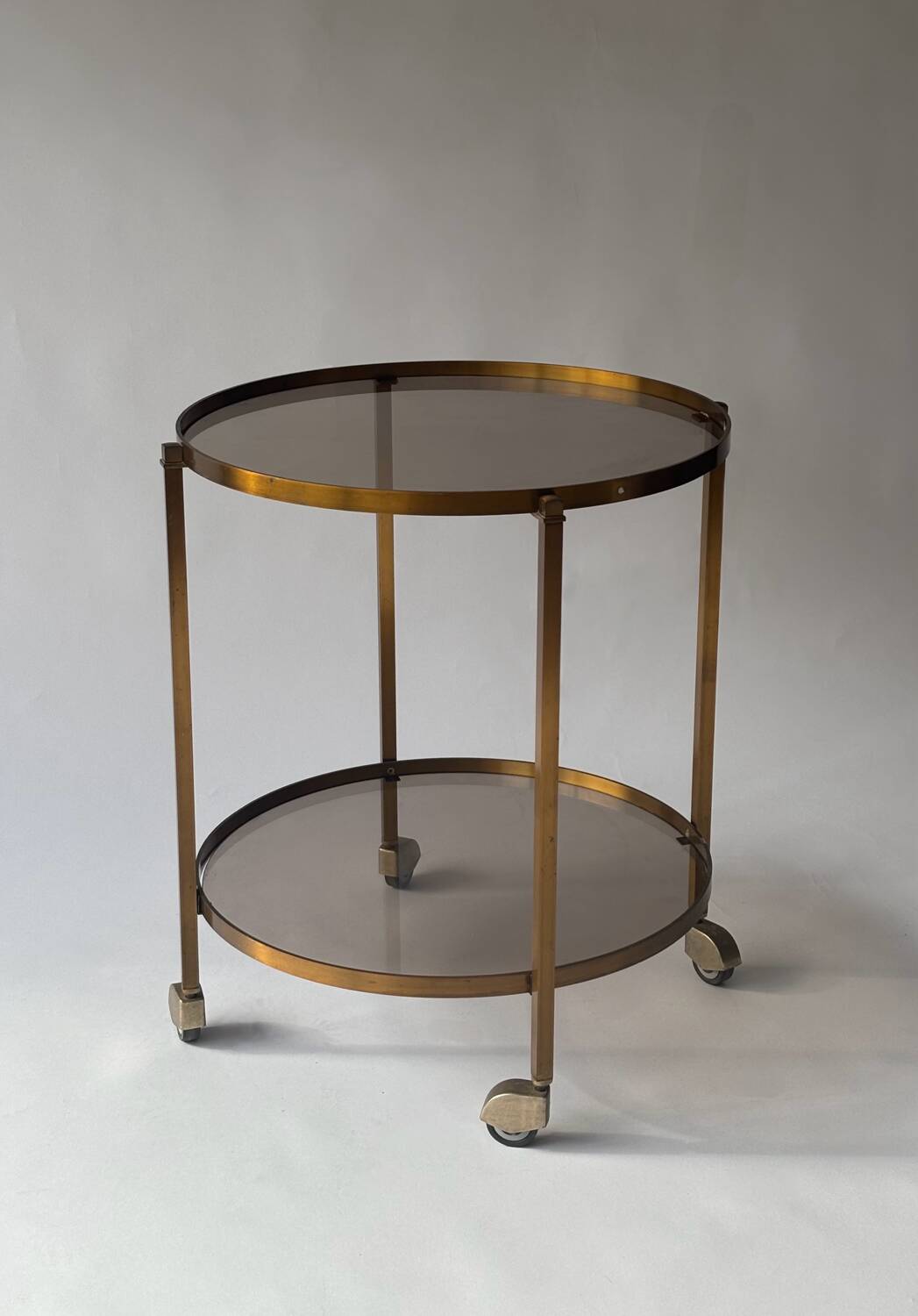 Rolling dessert trolley in brass and smoked glass, 1960