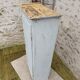 Old patinated bonnet maker