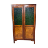 Vintage wooden display cabinet with green glass.