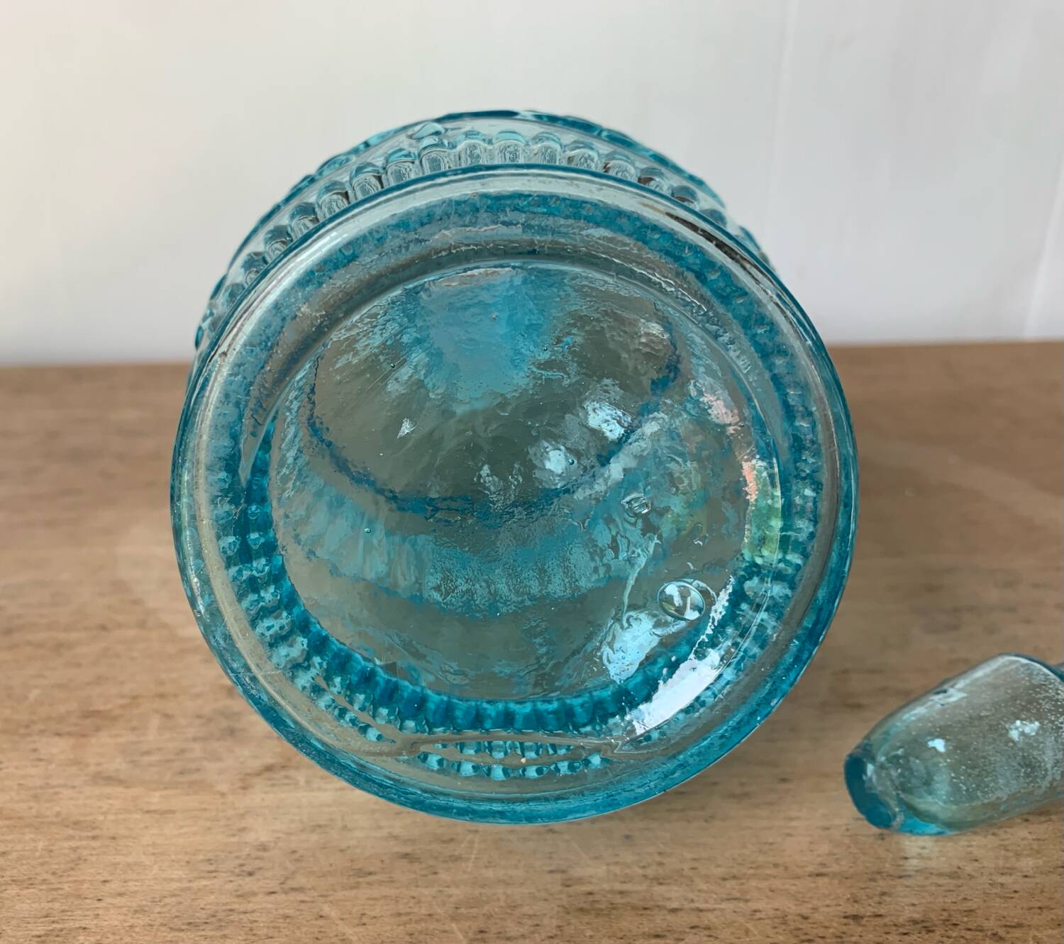 Old turquoise blue molded glass carafe