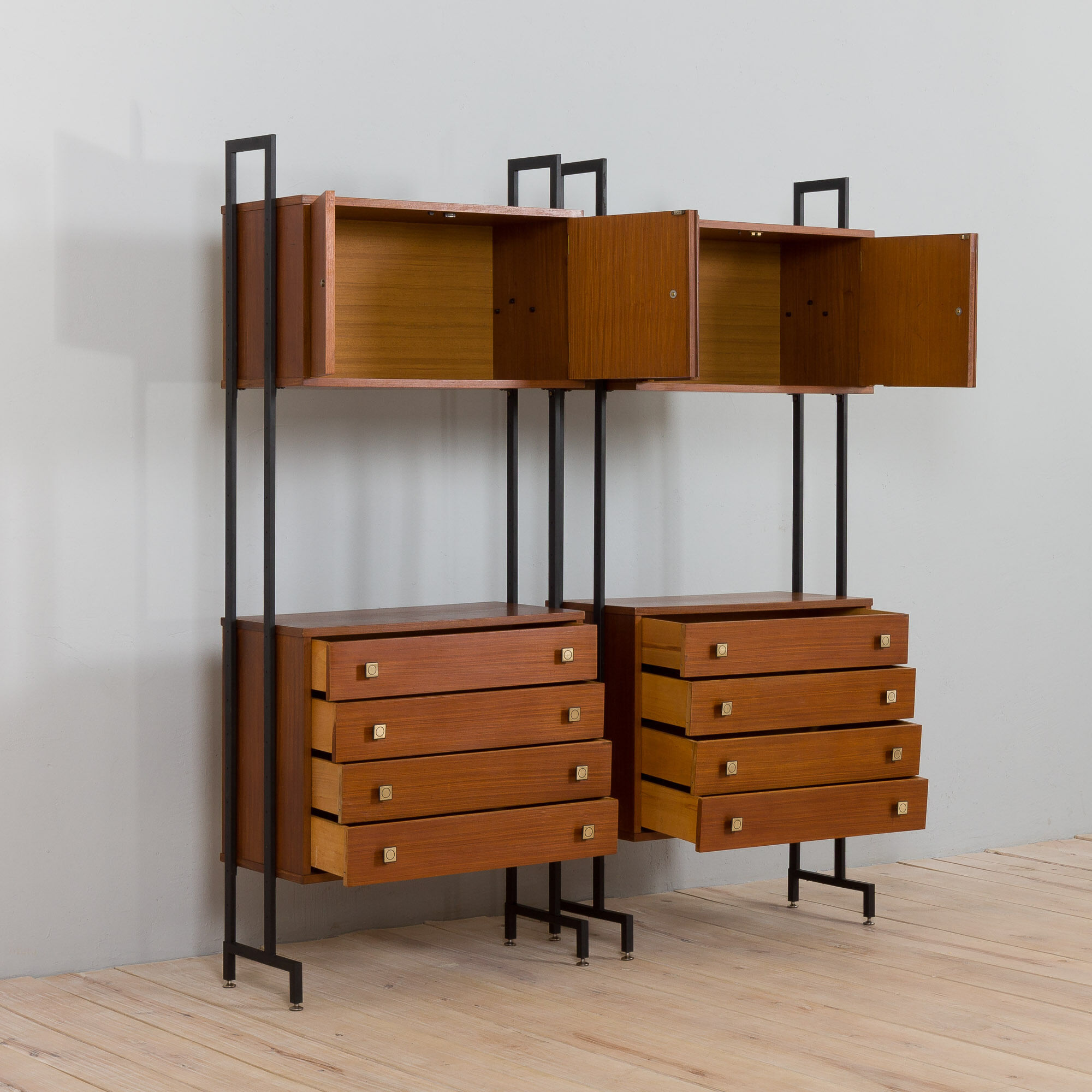 Pair of Italian mid century freestanding wall units in teak with brass handles.