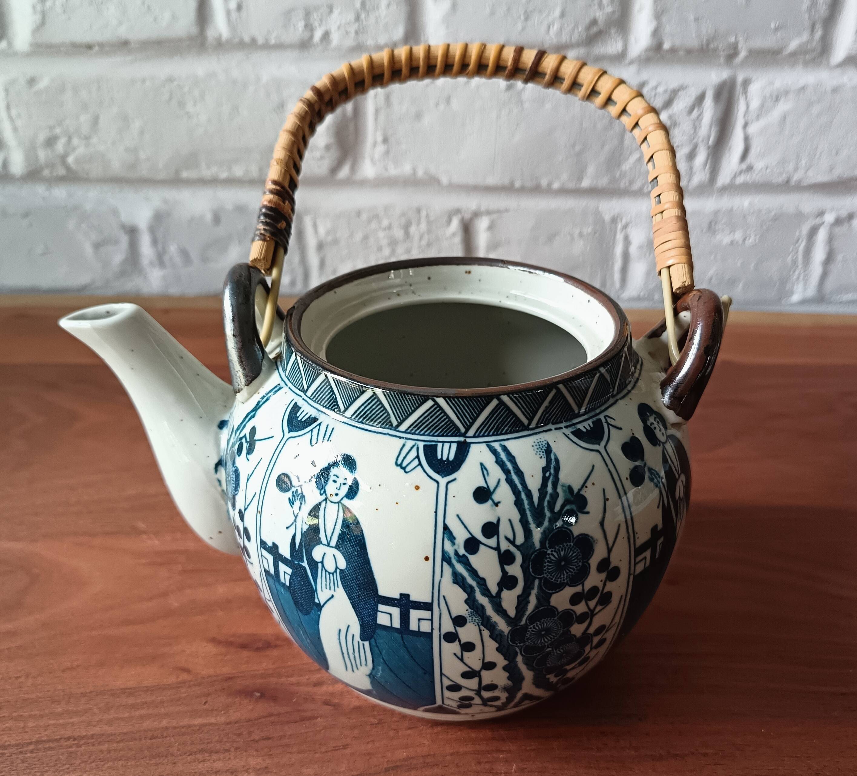 Asian ceramic and rattan tea set with plant geisha motifs