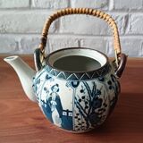 Asian ceramic and rattan tea set with plant geisha motifs