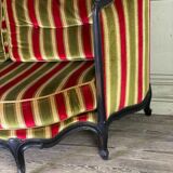 Louis XV style sofa in carved wood with a black patina