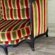 Louis XV style sofa in carved wood with a black patina