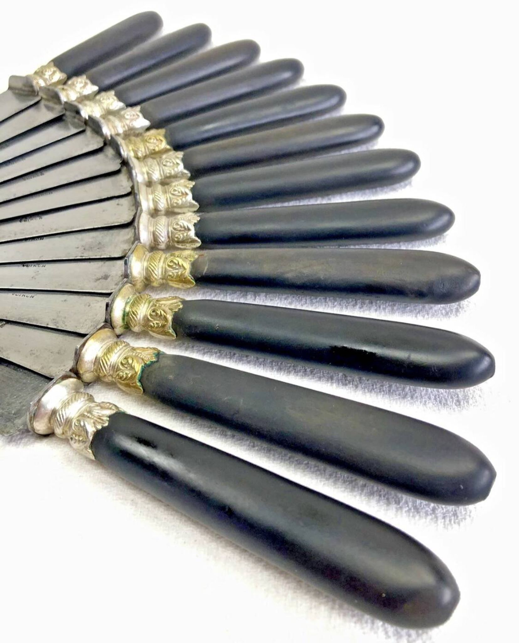 12 antique large table knives with ebony handles from the Napoleonic III period.