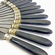 12 antique large table knives with ebony handles from the Napoleonic III period.