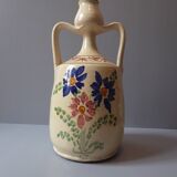 Polychrome earthenware vase decorated with flowers