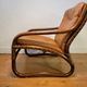 Vintage rattan armchair with leather cushions from 1970