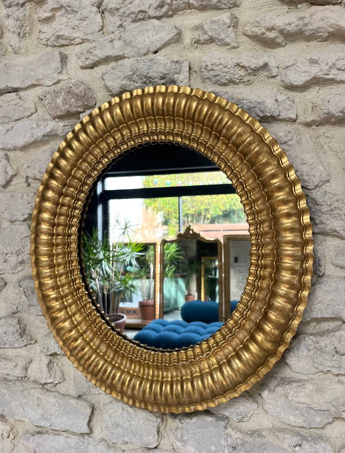 Pair of antique oval mirrors gilded with gold leaf and mercury.