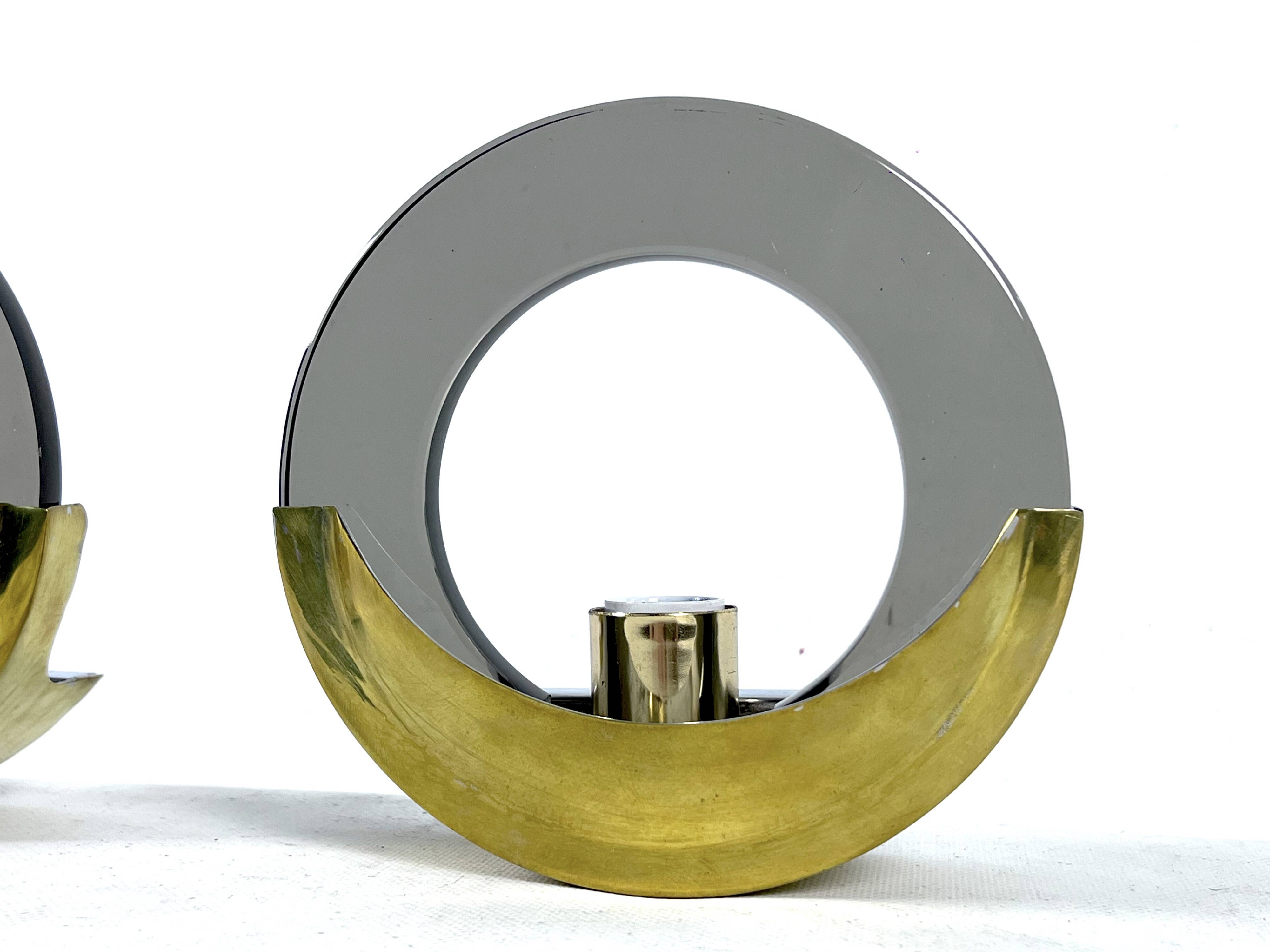 Mid-Century Modern pair of brass and thick smoked glass sconces. Italy 1970s