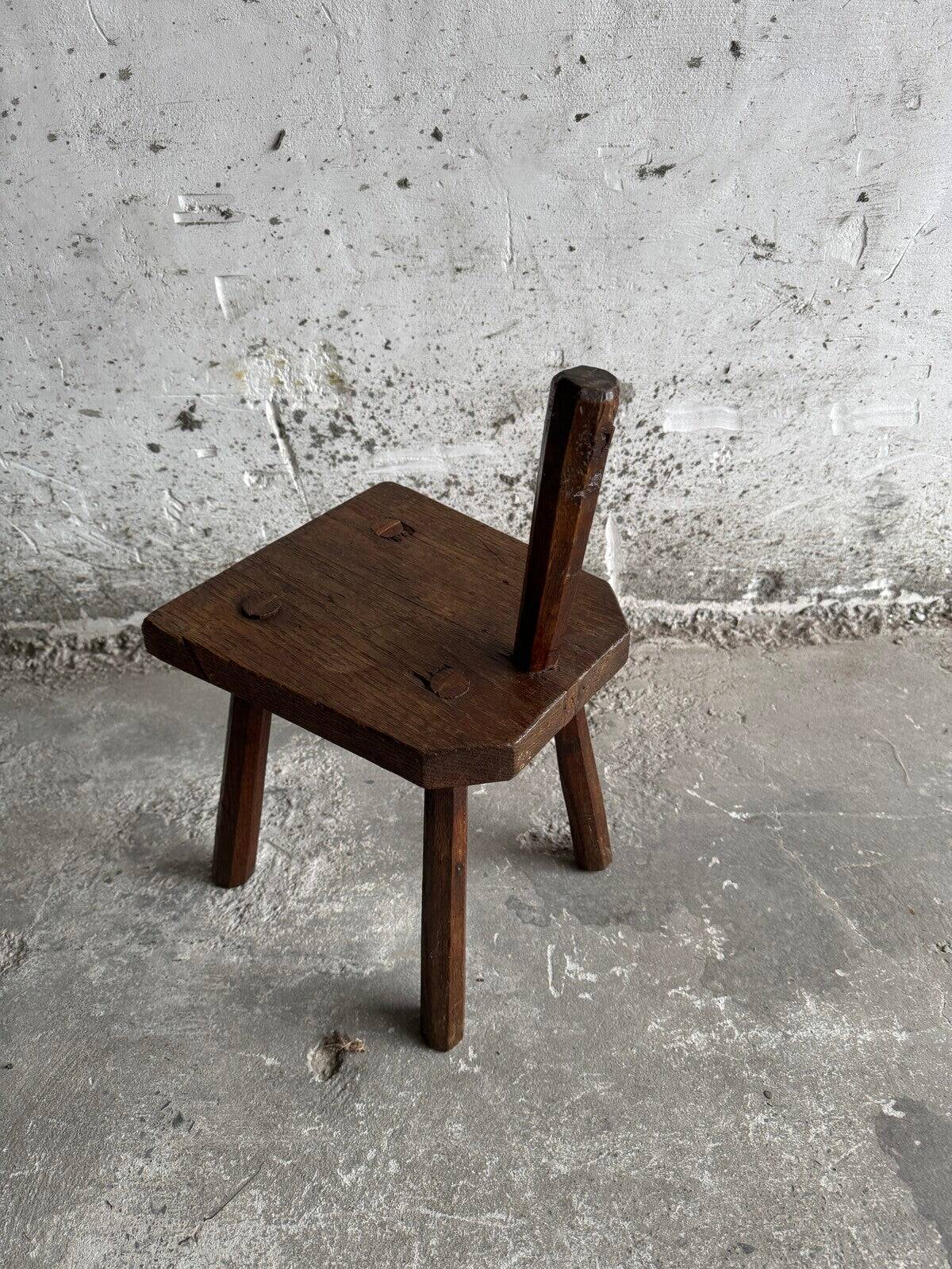 Dark brown solid oak brutalist stool with sculptural backrest, handcrafted mid-century rustic primitive