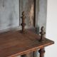 Napoleon III spool shelf, floor-standing shelf with brass tips.
