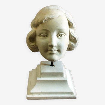 Plaster head of young girl from the 1930s