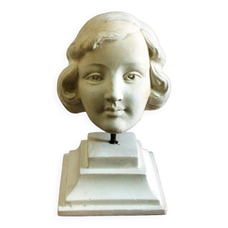 Plaster head of young girl from the 1930s