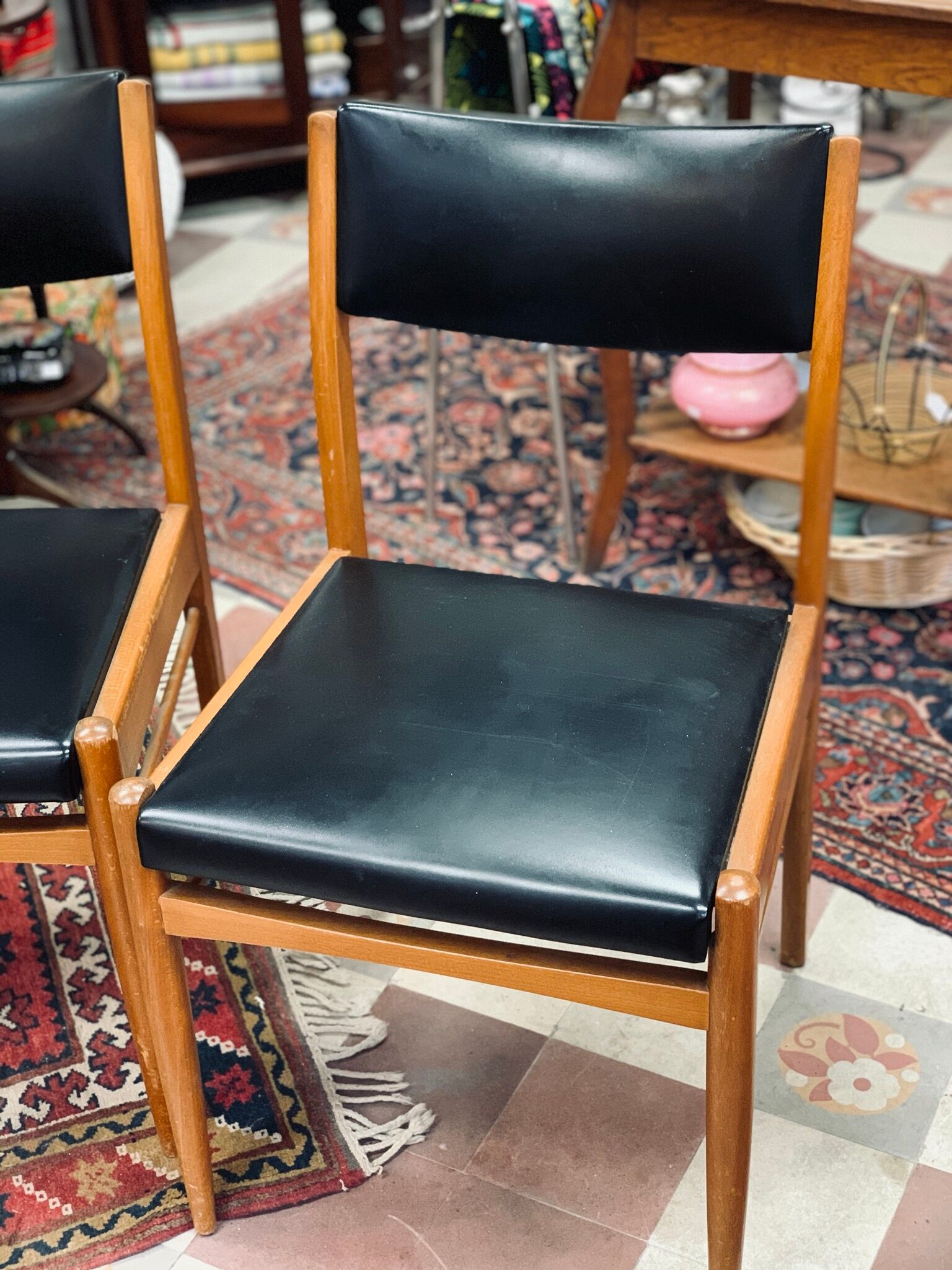 2 Scandinavian-style natural wood chairs, black trim