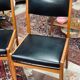 2 Scandinavian-style natural wood chairs, black trim