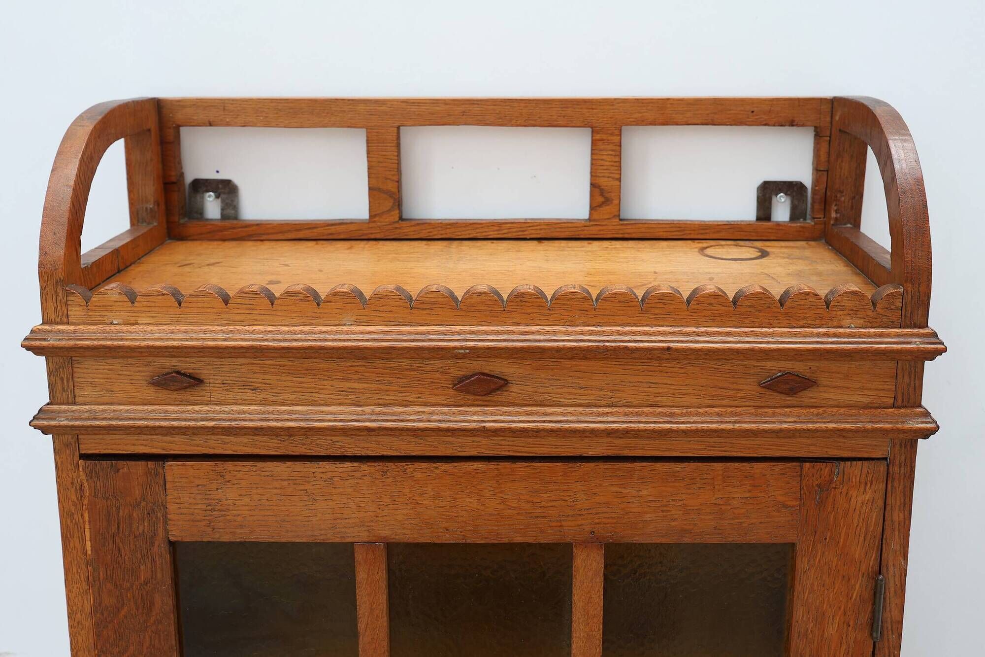 Art Deco oak wall cabinet with amber glazed door, Belgium ca. 1925