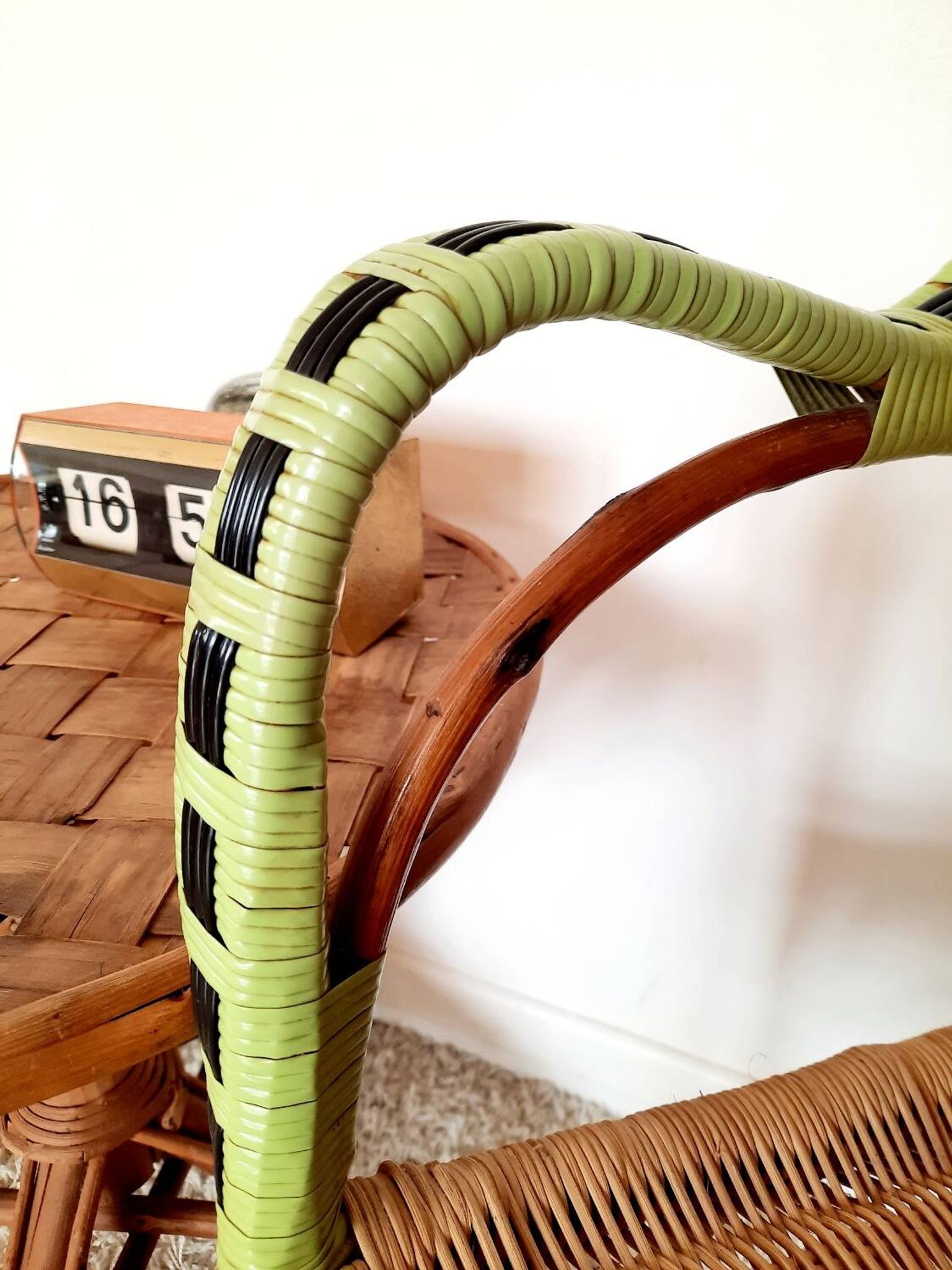 1950s 60s rattan armchair with green apple and black piping.