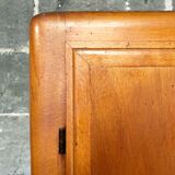 Vintage wooden cabinet with compass feet
