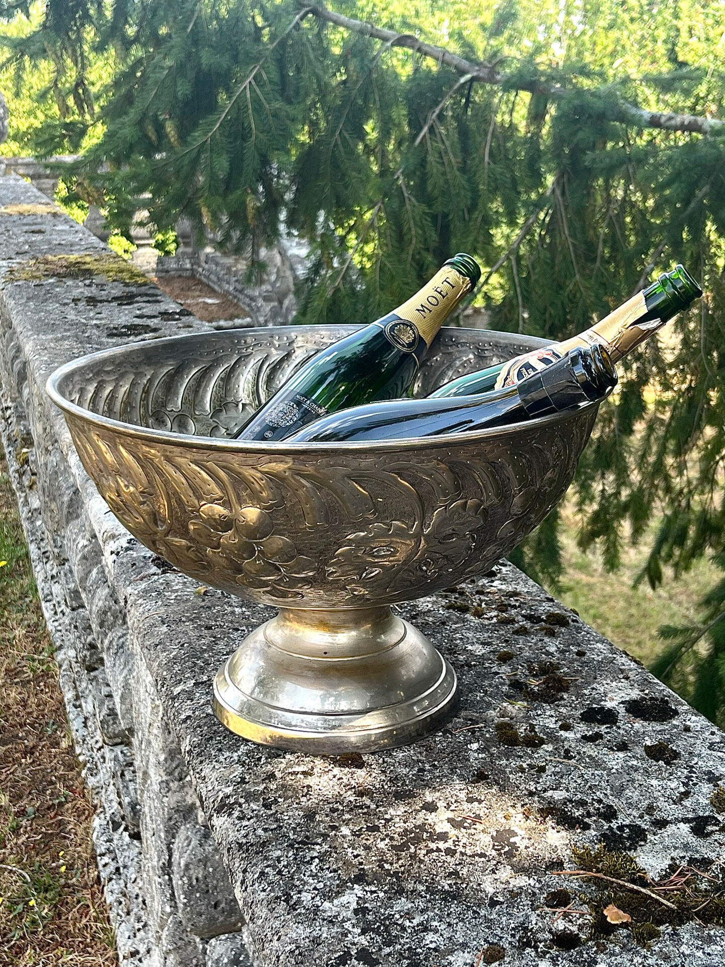 Large silver plated champagne cooler bowl on pedestal with grape
