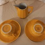 Set of two yellow Apilco coffee cups and saucers and a matching water or milk jar.