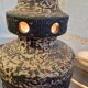 Ceramic lamp with openwork design and double lighting