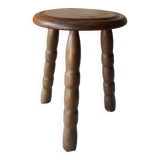 Old farm stool, wooden tripod campaign