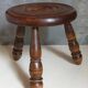 Low tripod stool in vintage turned solid wood