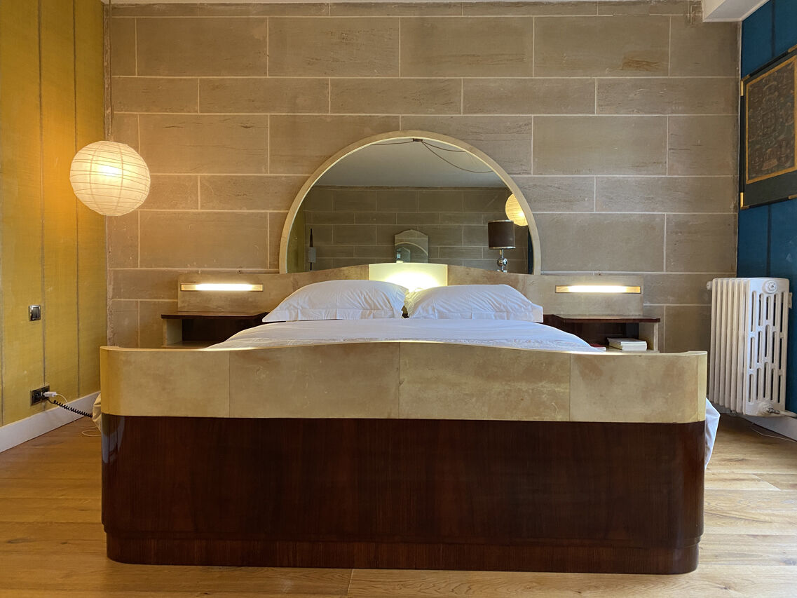 Bed with integrated bedside in rosewood and parchment, art deco period, twentieth century