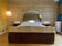 Bed with integrated bedside in rosewood and parchment, art deco period, twentieth century