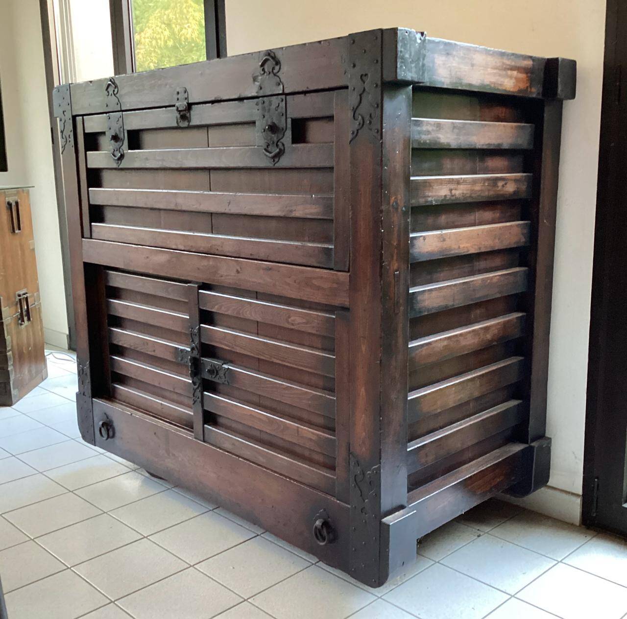 Japanese antique wooden chest with black fittings.