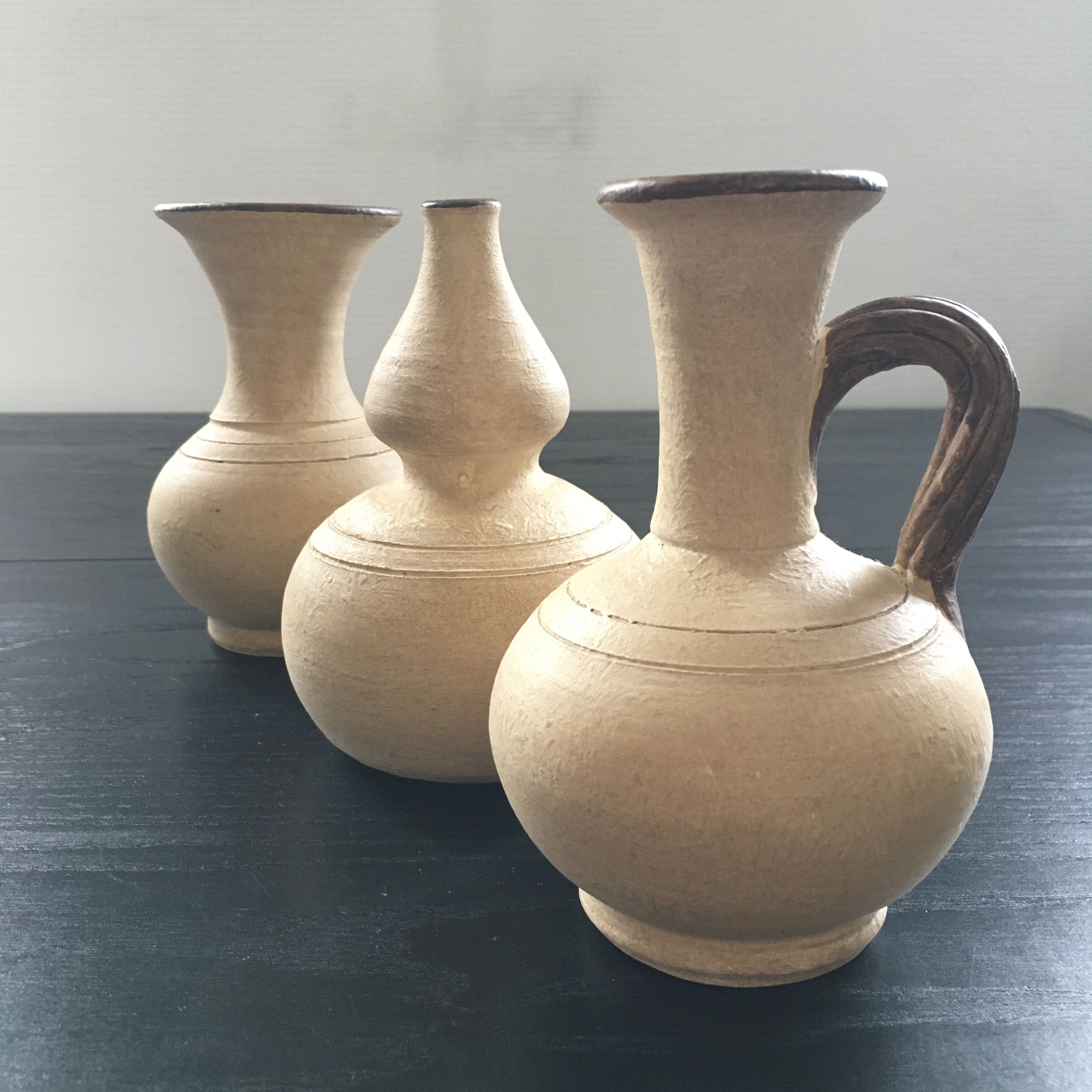 Trio of terracotta vases