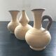 Trio of terracotta vases