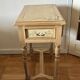 exotic wood console with a drawer