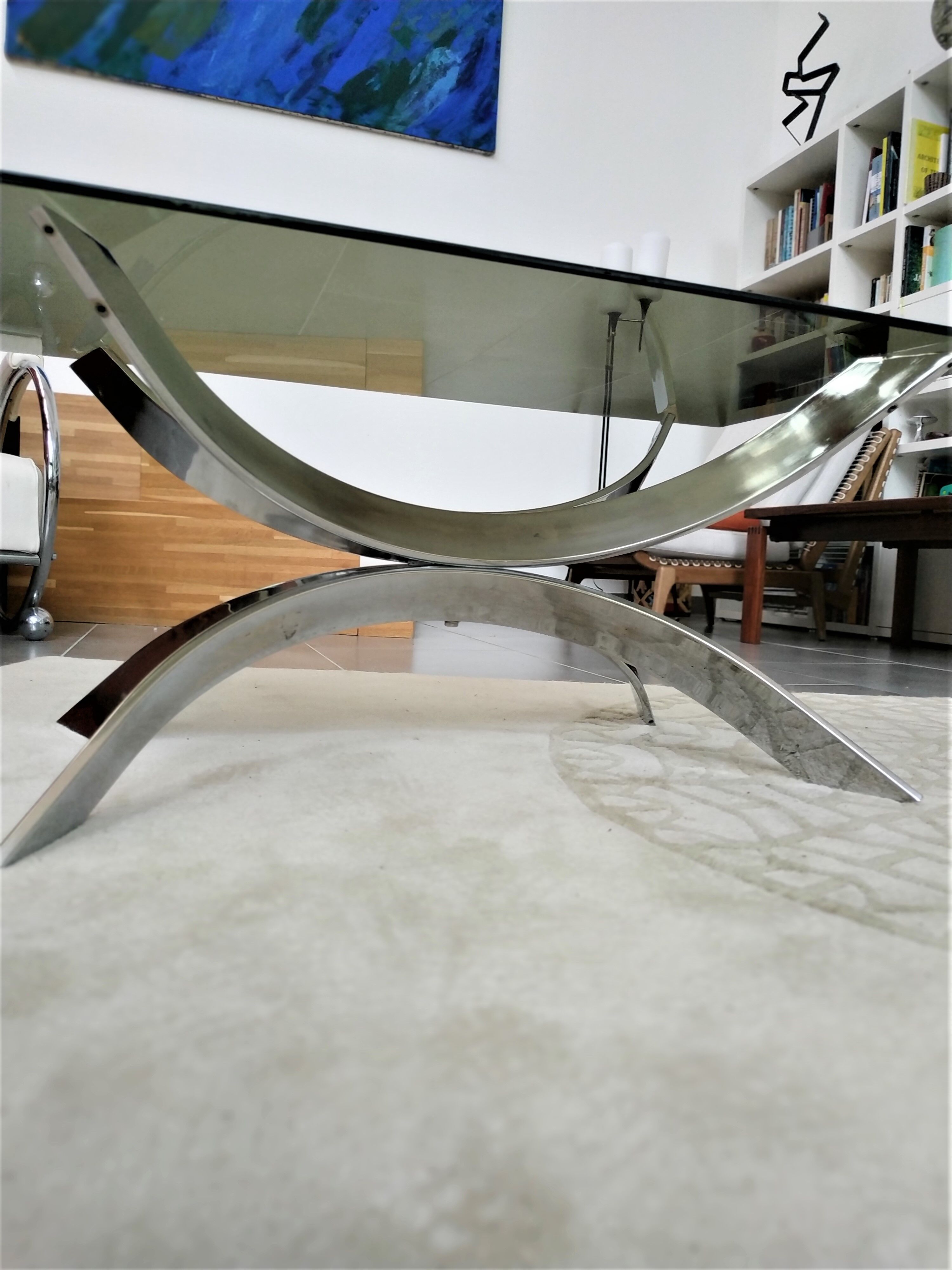 A chrome-shaped table and a 70s glass tray