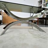 A chrome-shaped table and a 70s glass tray