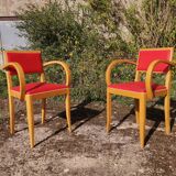 Pair of bridge armchairs in red Skaï
