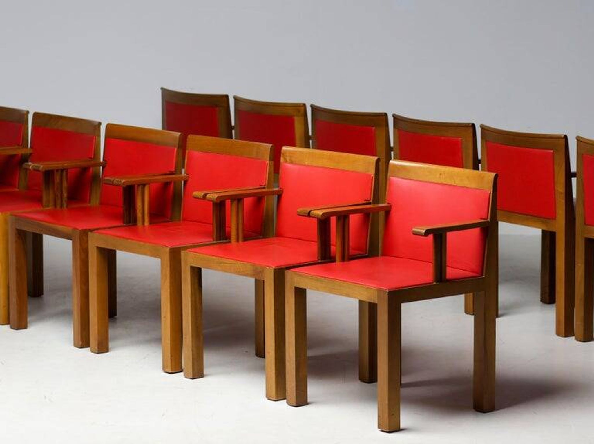 A masterpiece of Italian modernism: eleven Aldo Rossi red Teatro arm chairs