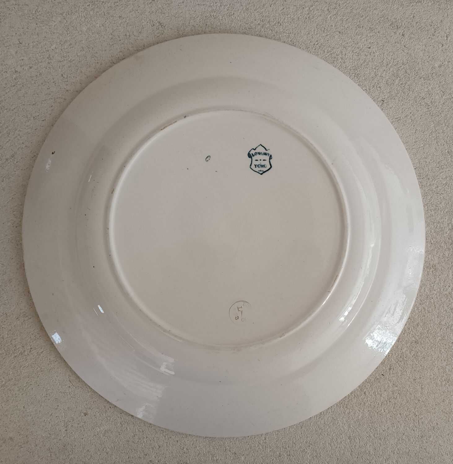 2 plates and a Longwy iron earth dish