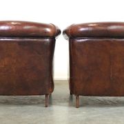 Set of two rugged sheep let of two rugged sheep leather club armchairs with a nice distressed look